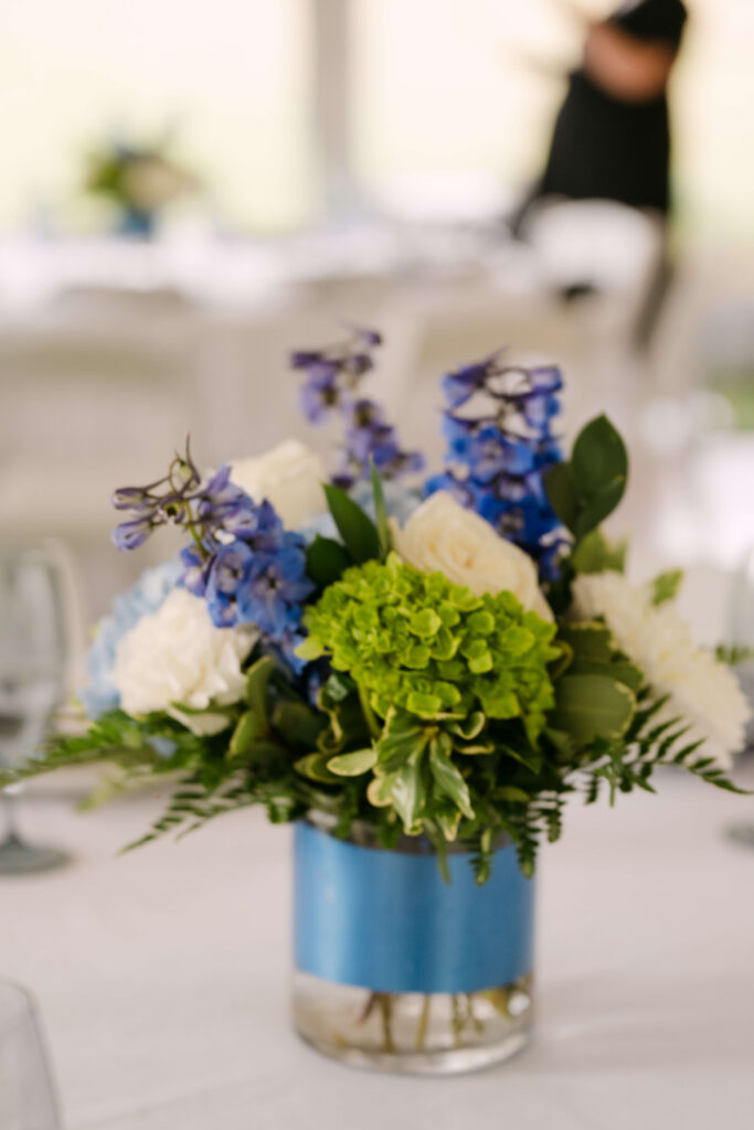 Blue and white wedding centerpiece details at elegant Massachusetts backyard wedding Massachusetts wedding planner and photographed by Massachusetts wedding photographer