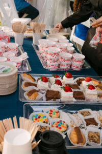 Dessert table with cupcakes and sweets at backyard Massachusetts wedding reception Massachusetts wedding planner and photographed by Massachusetts wedding photographer